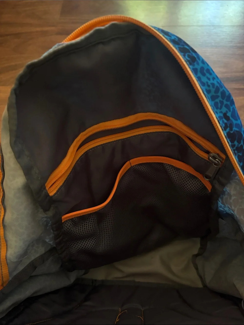 The North Face Recon Squash Teal Leopard Print Backpack with Orange Accents